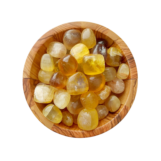 A wooden bowl filled with polished Yellow Fluorite Tumbled Stones and captivating crystals of various shades and transparency levels. The stones are smooth and rounded, creating a visually appealing assortment within the bowl. The background is plain white.