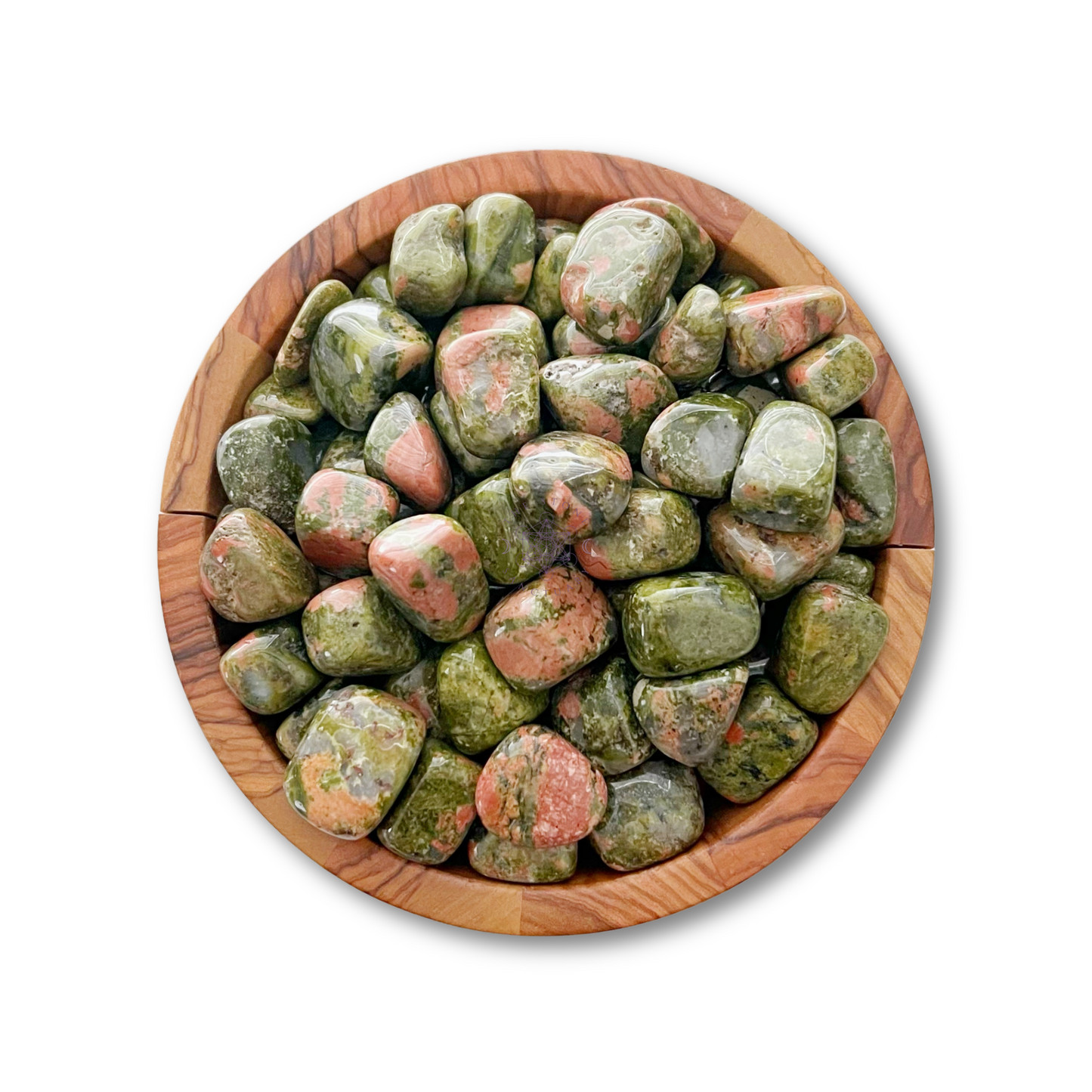 A wooden bowl filled with Unakite Tumbled Stones, known for promoting emotional balance. The stones are predominantly green with pink and salmon-colored flecks. The smooth, rounded healing crystals are tightly packed within the circular bowl set against a plain white background.