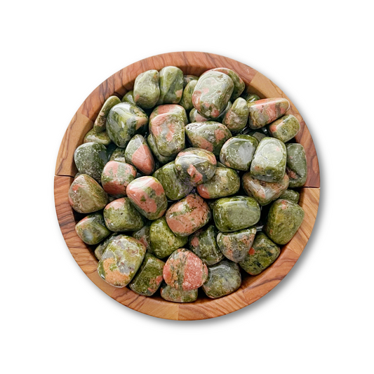 A wooden bowl filled with Unakite Tumbled Stones, known for promoting emotional balance. The stones are predominantly green with pink and salmon-colored flecks. The smooth, rounded healing crystals are tightly packed within the circular bowl set against a plain white background.