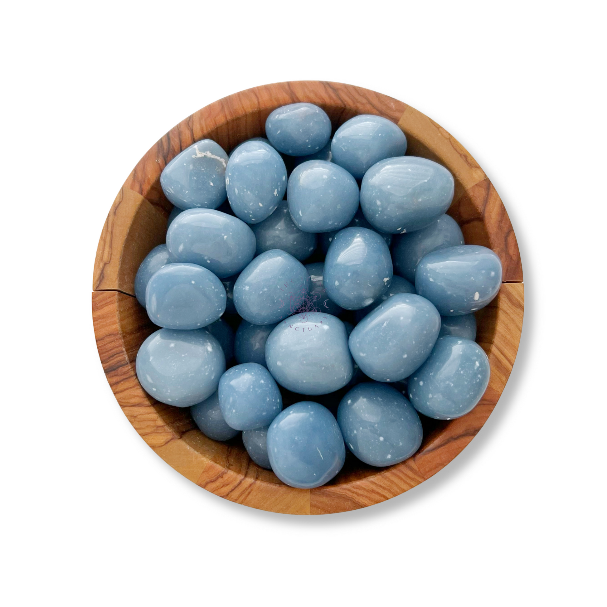 A wooden bowl filled with smooth, polished Angelite Tumbled Stones. The light blue gems are uniformly shaped and glossy, with a soft sheen that reflects light, enhancing their smooth texture. Perfect for fostering psychological healing or establishing a spiritual connection.