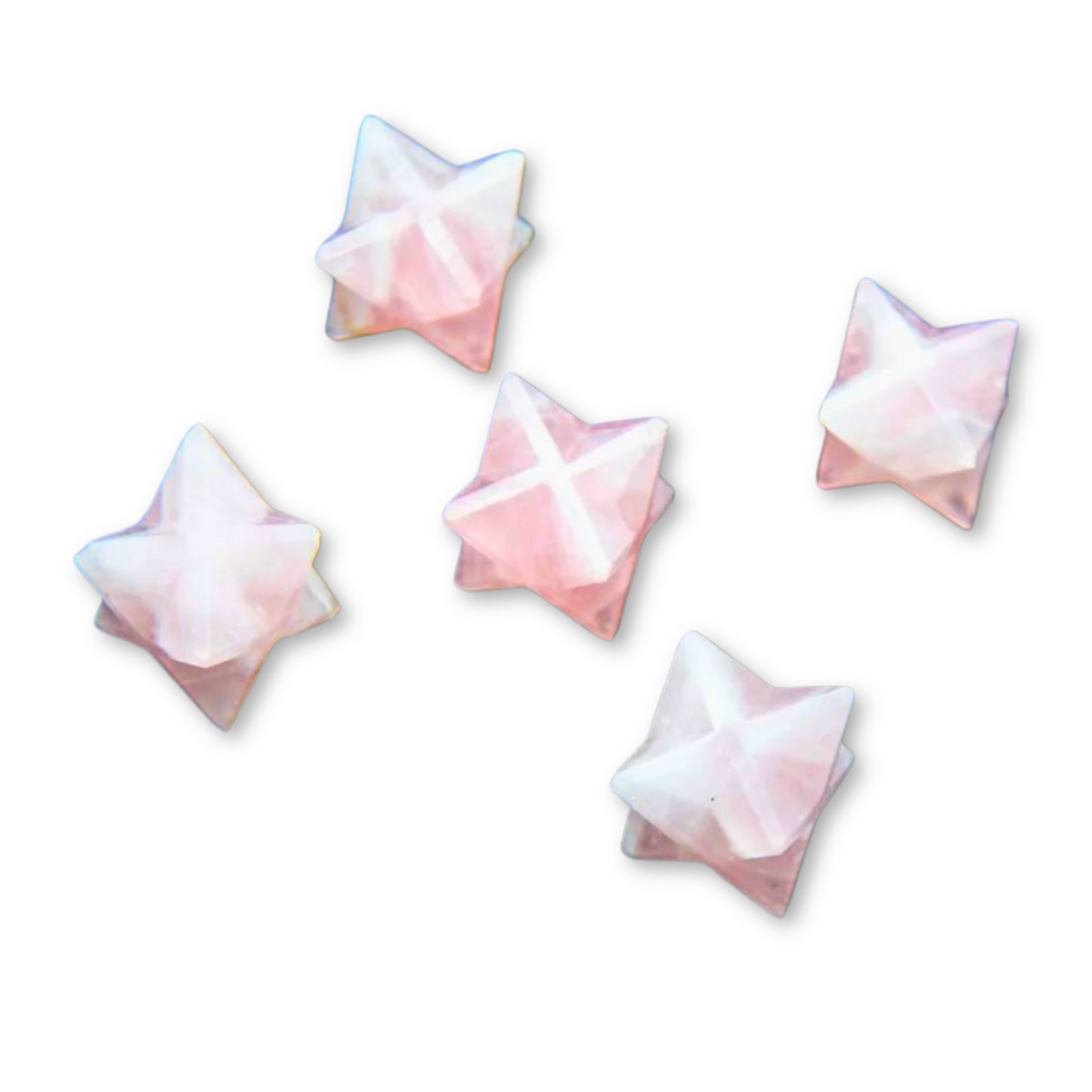 Five pink, pearlescent Mini Rose Quartz Merkaba are arranged randomly on a white background. Each Mini Rose Quartz Merkaba has a subtly translucent quality and a soft gradient that shifts from light pink to white, reminiscent of Rose Quartz. The edges and facets of the Mini Rose Quartz Merkaba are slightly highlighted.