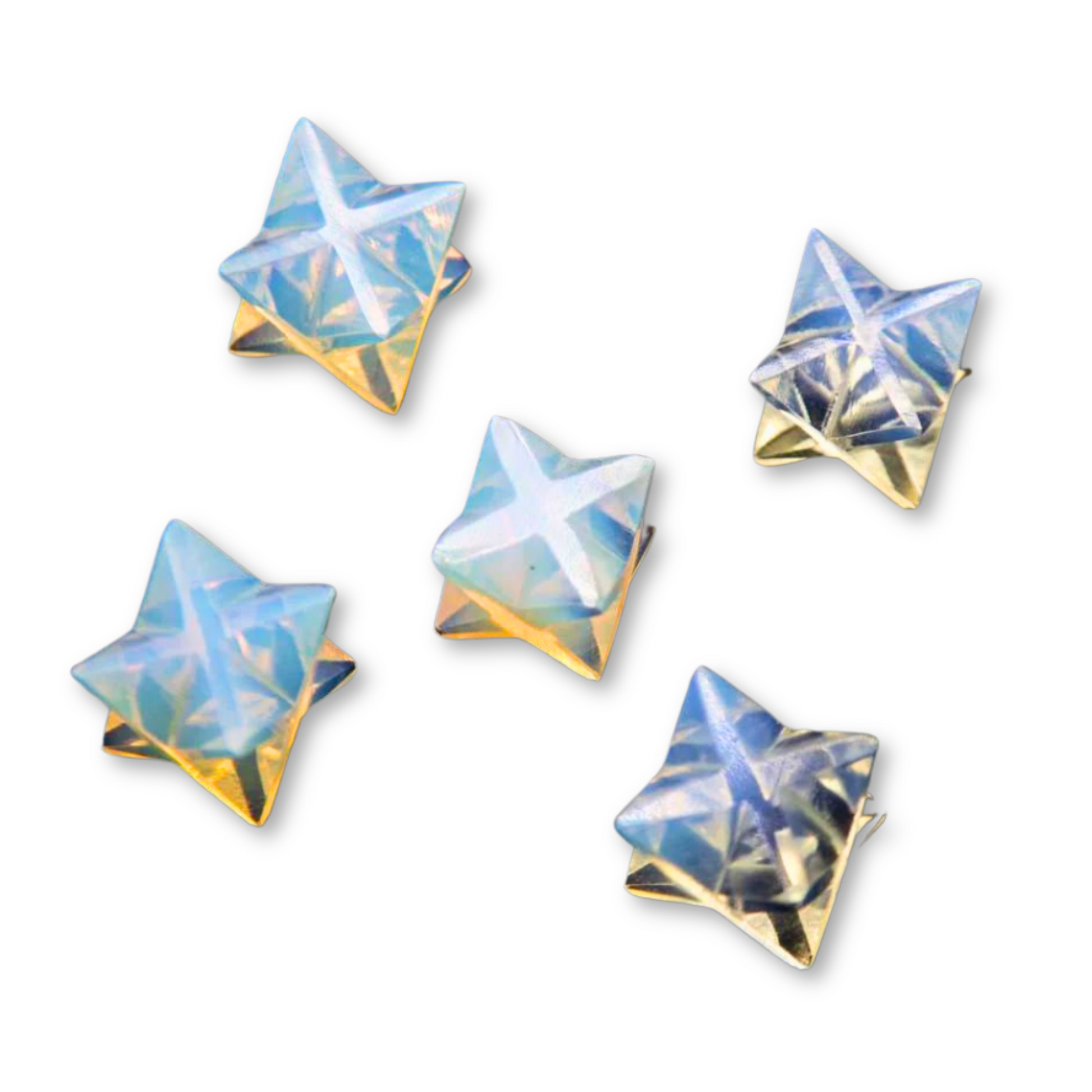 Five metallic, iridescent Mini Opalite Merkaba with a textured surface, arranged in a scattered pattern against a white background. The stars reflect light with a combination of blue, purple, and gold hues, evoking a sense of spiritual illumination.