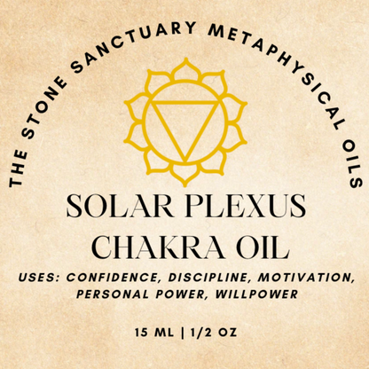 A small bottle of Solar Plexus Chakra Oil rests among succulent plants. The bottle holds yellow liquid infused with floating herbs and flowers. Its label features a yellow-chakra symbol along with the product's name, highlighting its benefits for promoting self-empowerment and confidence.