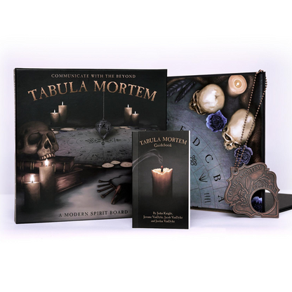 A modern spirit board set titled "Tabula Mortem: A Modern Spirit Board" is displayed, featuring a planchette and decorated with candles, skulls, a rose, and esoteric symbols. The board lies on a mystical background with an alphabet wheel, symbolic cave runes, and an unreadable ancient scroll.