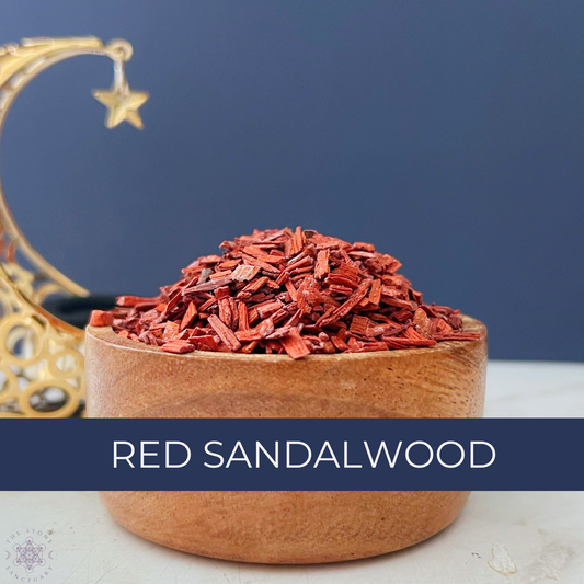 A wooden bowl filled with Red Sandalwood Chips is placed on a white surface. The background features a dark blue wall and golden decorative crescent moon and star elements. Text at the bottom of the image reads "RED SANDALWOOD.