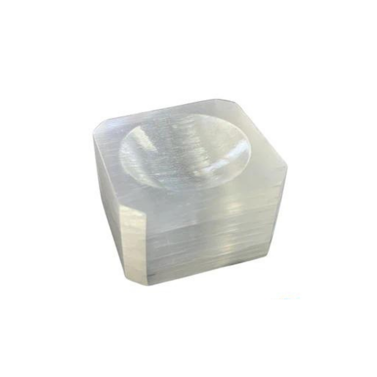 A translucent, cubic crystal with a smooth, clear surface and a shallow, concave indentation on the top center makes for an exquisite 1" Selenite Cube Sphere Holder. This crystal reflects light beautifully, showcasing its clear and glossy appearance. The sharp edges contribute to the clean and polished look, ideal for any spiritual setting.