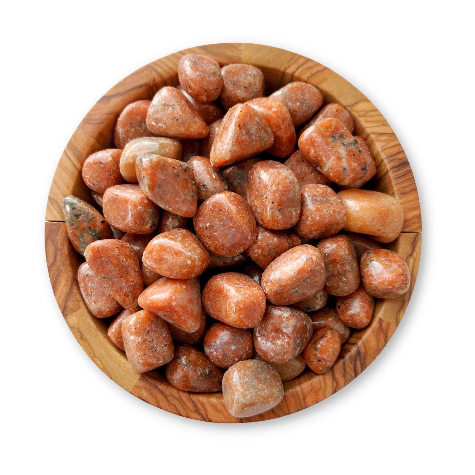 A wooden bowl filled with Orchid Calcite Tumbled Stones of various shapes and sizes. The stones have a smooth, shiny surface, and the bowl is made from light brown wood with visible grain patterns. The image is taken from above on a white background.