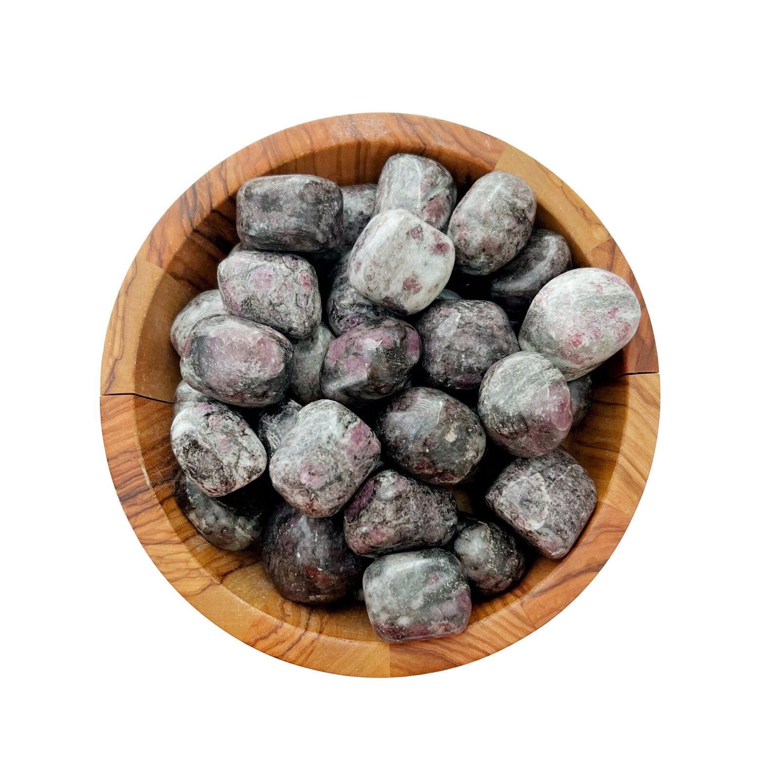 A wooden bowl filled with several tumbled and polished stones, featuring a mix of gray and pink hues. Among the smooth-textured stones, a beautiful Garnet in Astrophyllite Tumbled Stones stands out. The background is white, highlighting the bowl and its contents.