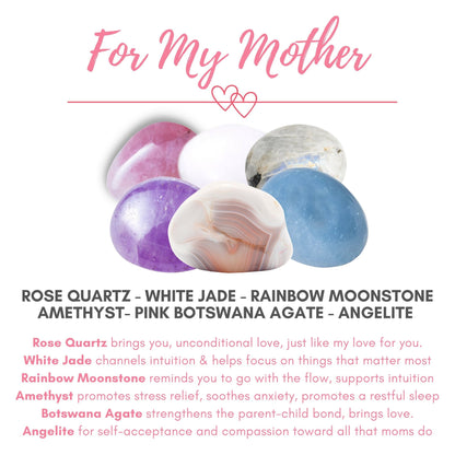 An image titled "For My Mother" showcases six gemstones: Rose Quartz, White Jade, Rainbow Moonstone, Amethyst, Pink Botswana Agate, and Angelite. Each stone's properties promote love, intuition, stress relief, strength, and compassion—making it an ideal relaxation gift and For My Mother Crystal Kit.