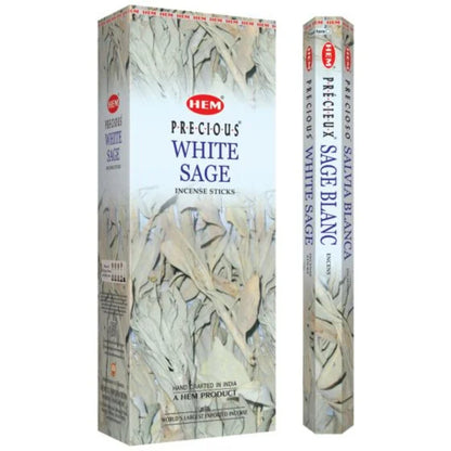 A rectangular box and a smaller, cylindrical package of White Sage Incense Sticks are shown side by side. The packaging features images of white sage leaves, ideal for enhancing your meditation rituals. The labels include text in English, French, and Spanish.