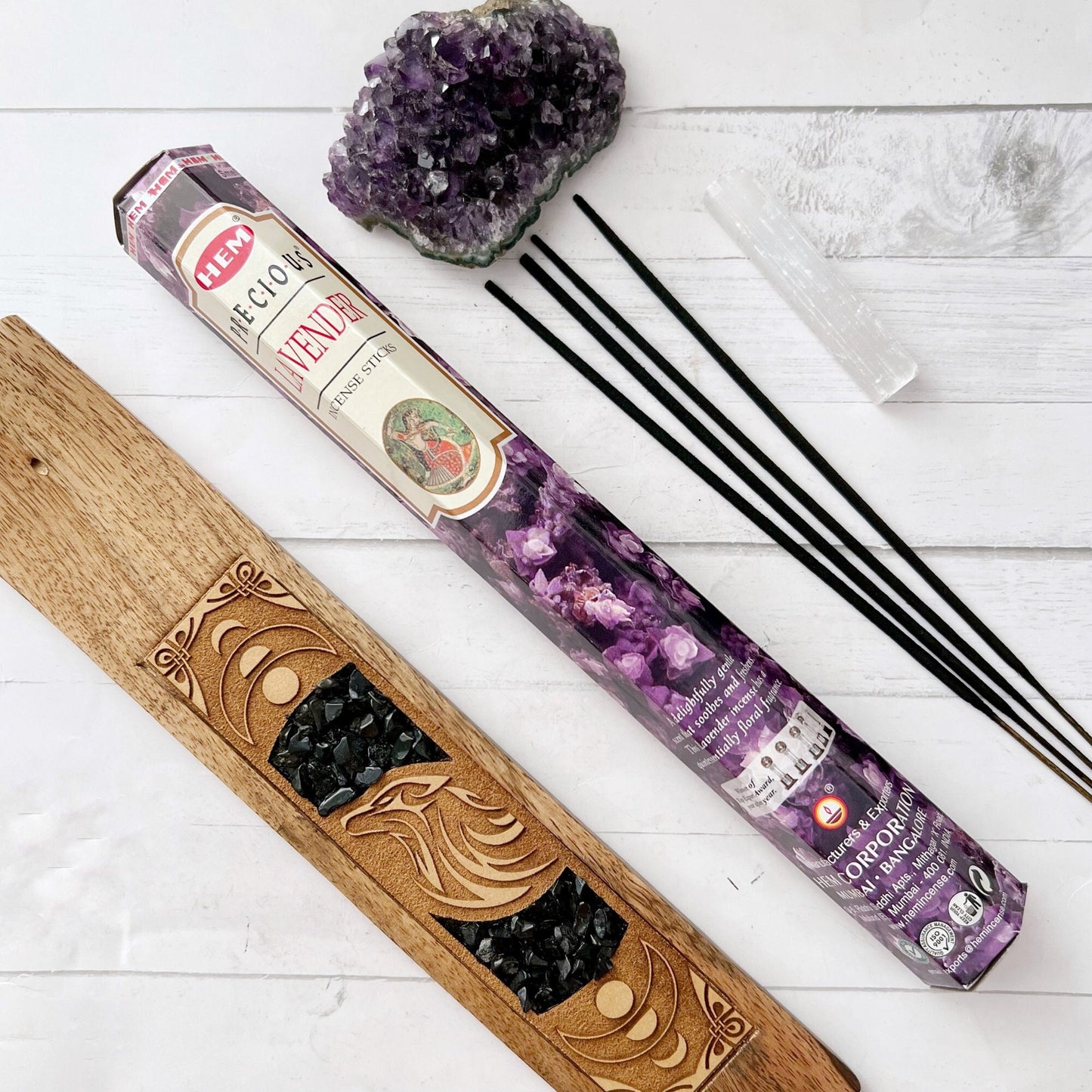 Image of Precious Lavender Incense Sticks packaging. The boxes are adorned with purple lavender blossoms, evoking a sense of relaxation. One box is large and rectangular, while the other is smaller and cylindrical. The text reads "Lavender" with a subtext "Incense Sticks.