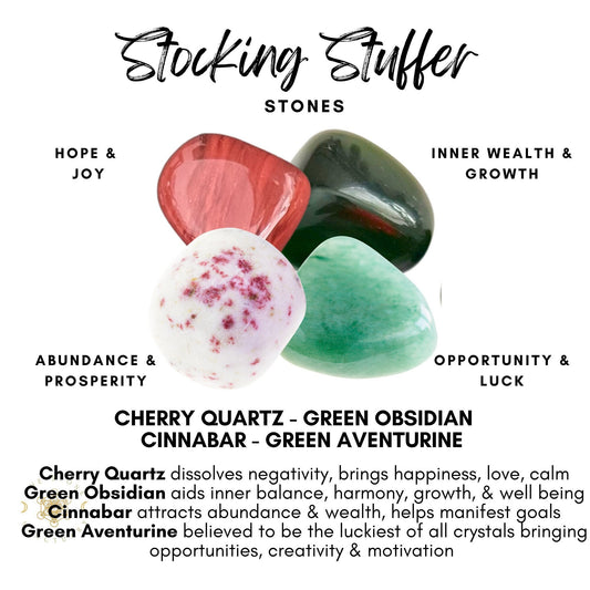 Image of four gemstones labeled "Stocking Stuffer Crystal Kit." Cherry Quartz (red) for Hope & Joy, Green Obsidian (green) for Inner Wealth & Growth, Cinnabar (white with red spots) for Abundance & Prosperity, and Green Aventurine (green) for Opportunity & Luck. Ideal holiday gift with benefits described below each stone.